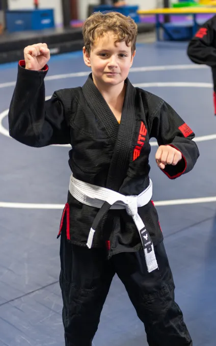 Young martial arts students practicing Wrestling techniques