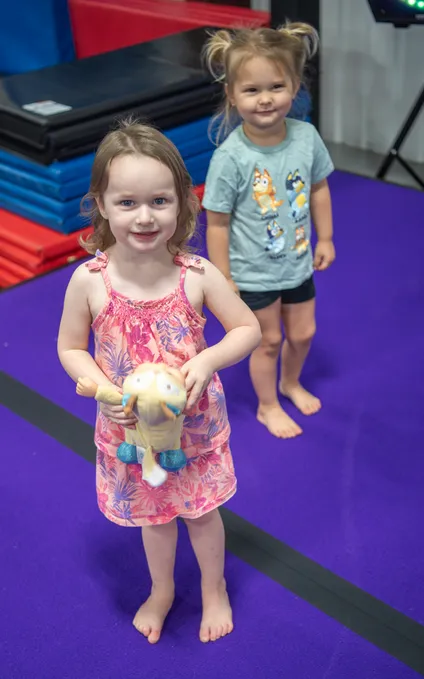 Children happily engaged in supervised play and learning activities